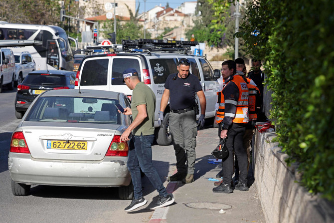 Israeli security forces inspect the scene of a shooting attack in the neighbourhood of Sheikh Jarrah in annexed east Jerusalem, on April 18, 2023. (AFP)