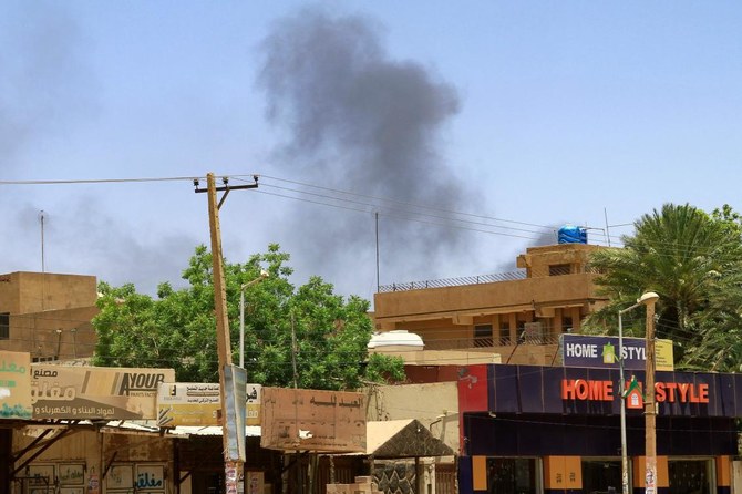 Smoke rises behind buildings in Khartoum on April 19, 2023, as fighting between the army and paramilitaries raged for a fifth day after a 24-hour truce collapsed. (Photo by AFP)
