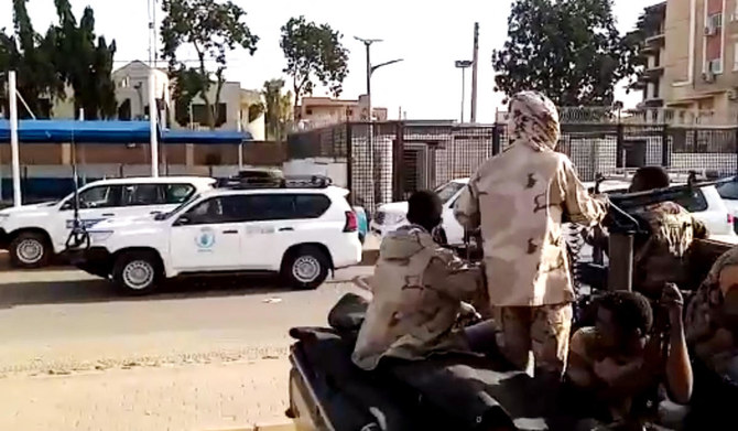 A grab taken from an AFPTV video shows a convoy leaving Khartoum towards Port Sudan, on April 23, 2023, as people flee the battle-torn Sudanese capital. (AFP)