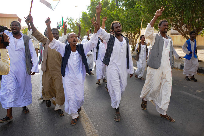 Civilians rally behind Sudan's army headed by Abdel Fattah Al-Burhan in the Red Sea city of Port Sudan, on April 20, 2023. (Photo by AFP)