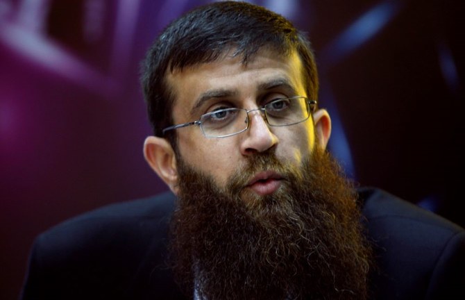 Khader Adnan during a television interview in the West Bank city of Ramallah, May 6, 2012. (AP Photo)