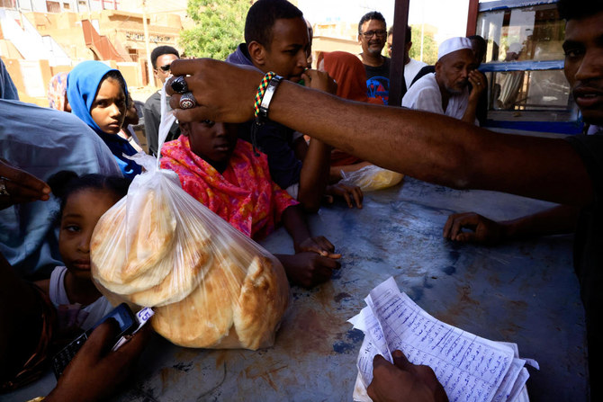 People gather to get bread during clashes between the paramilitary Rapid Support Forces and the army in Khartoum North, Sudan, April 22, 2023. REUTERS/Mohamed Nureldin Abdallah