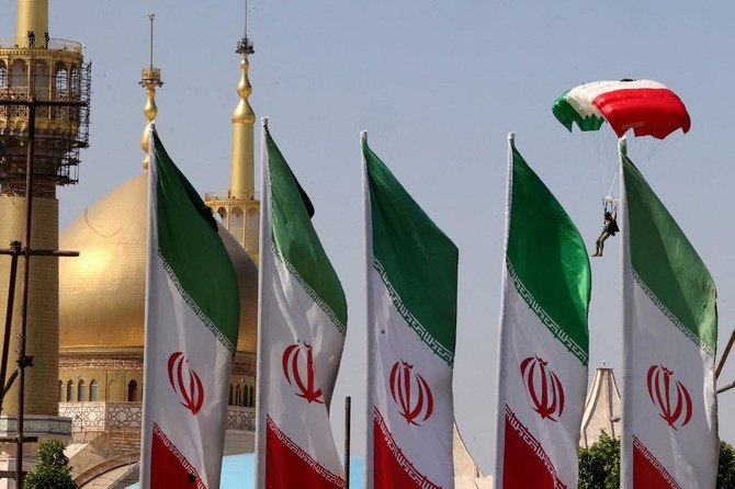 An Iranian paratrooper descends during a military parade marking the country's annual army day in the capital Tehran on April 18, 2023. (AFP)