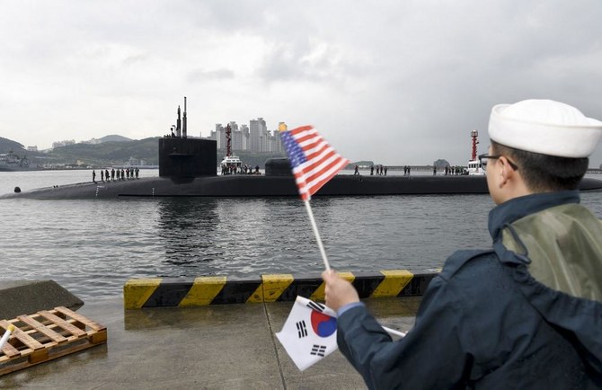 Above, the Ohio-class guided-missile submarine USS Michigan being greeted on April 25, 2017 as it arrives in Busan, South Korea for a scheduled port visit while conducting routine patrols throughout the western Pacific. (US Navy/AFP)