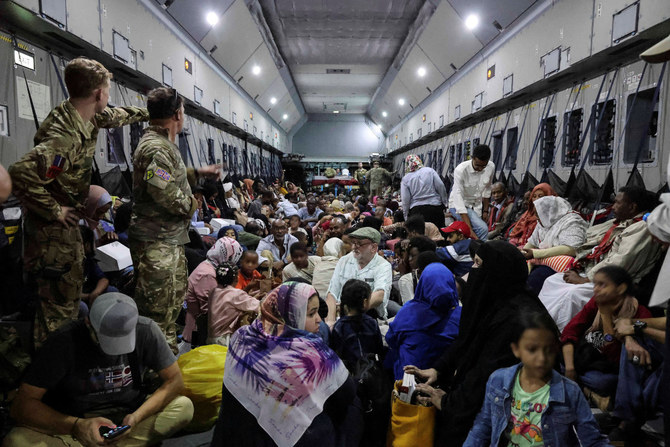 British nationals who got evacuated are seen onboard an RAF aircraft while on their way to Larnaca International Airport in Cyprus on April 26, 2023. (UK MOD/Handout via REUTERS)