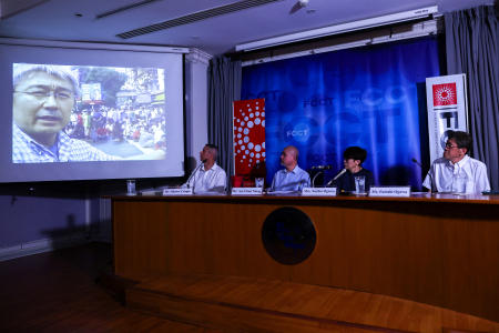 A screen shows unseen footage filmed by slain Japanese journalist Kenji Nagai, as his sister Noriko Ogawa and Aye Chan Naing, co-founder of the Democratic Voice of Burma (DVB), attend an event to return his lost videocamera during the coverage of the 2007 Saffron Revolution in Yangon, at the Foreign Correspondents' Club of Thailand in Bangkok, Thailand, April 26, 2023. (Reuters)