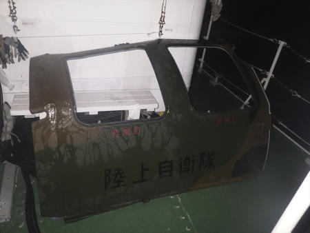 This photo provided by the 11th Regional Japan Coast Guard Headquarters shows the door that the coast guard found and retrieved from the sea, off Miyako Island, Okinawa Prefecture, southern Japan, Friday, April 7, 2023. (AP)