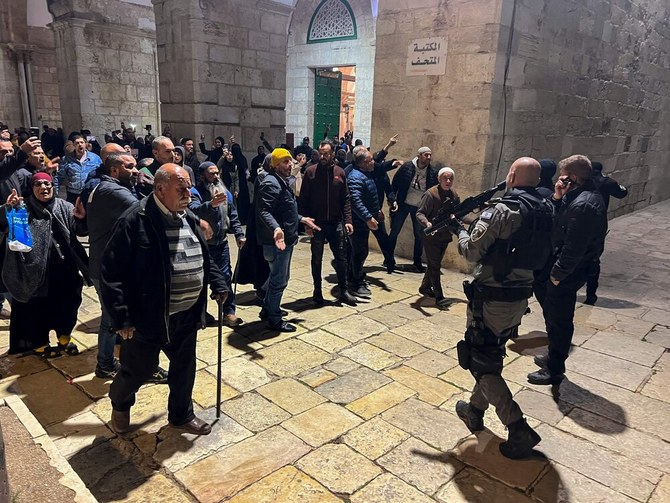 Palestinians shout slogans at Israeli security forces at the Al-Aqsa Mosque compound in Jerusalem, on Apr. 5, 2023. (AFP)