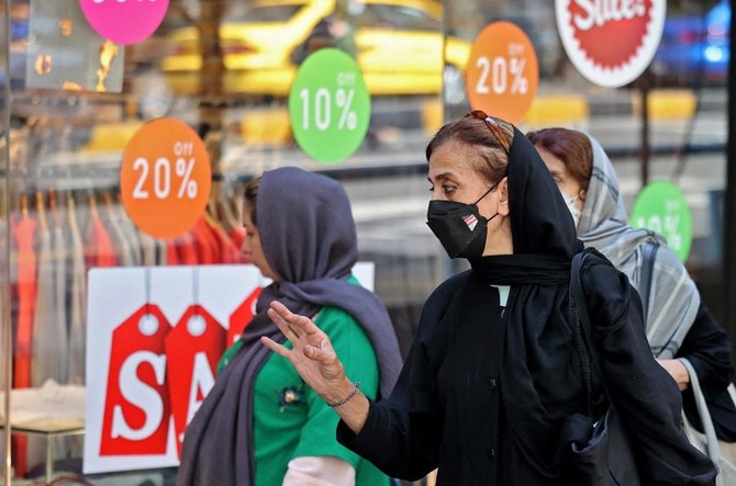 Iranians women shop at Tajrish bazaar in the capital Tehran, on September 20, 2022. (AFP)
