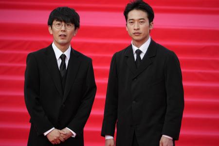 Japanese film directer Yutaka Tsunemachi (left), and actor Hiroyuki Sato pose on a red carpet at the closing ceremony of the 45th Moscow International Film Festival in Moscow, Russia, Thursday, April 27, 2023. (AP)