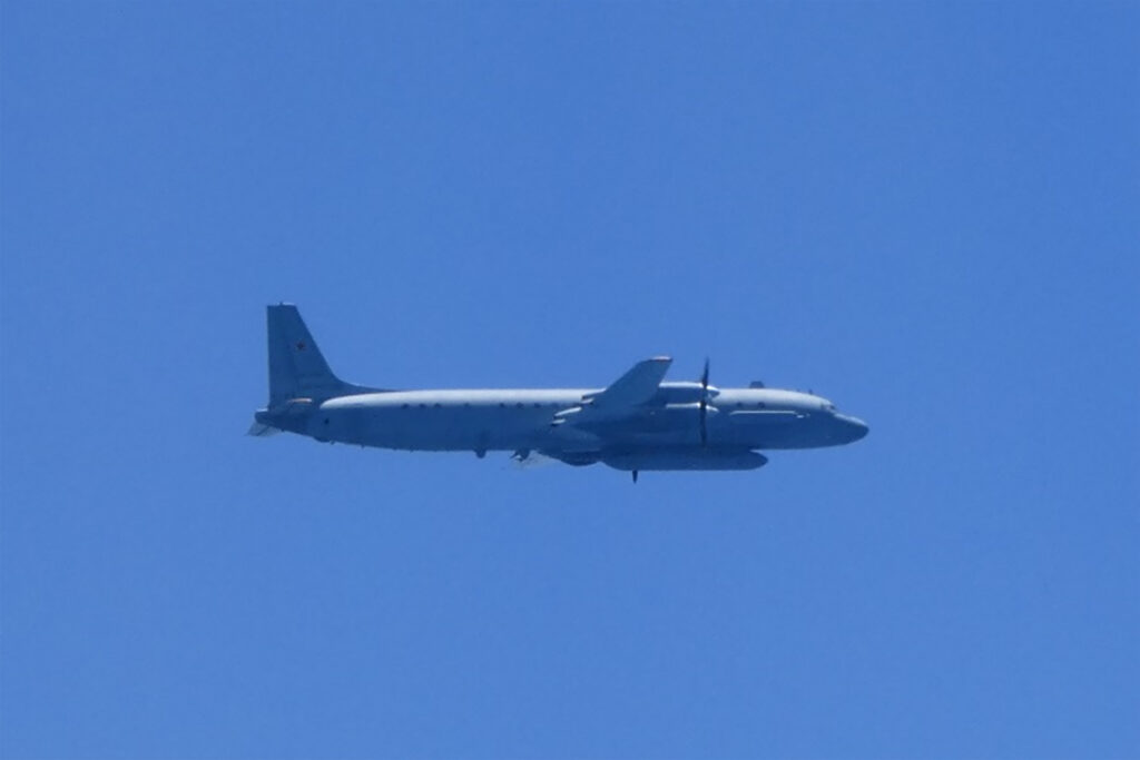 This handout photo taken and received on May 25, 2023 from Japan's Ministry of Defense shows a Russian Ilyushin IL-20 aircraft in the air off the west coast of Japan. Japan scrambled fighter jets on May 25 after Russian 