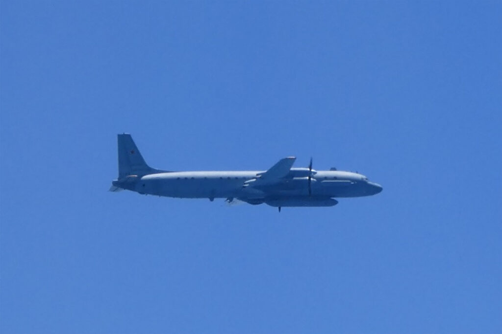 This handout photo taken and received on May 25, 2023 from Japan's Ministry of Defense shows a Russian Ilyushin IL-20 aircraft in the air off the west coast of Japan. Japan scrambled fighter jets on May 25 after Russian