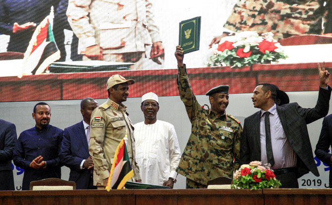 Gen. Abdel Fattah Al- Burhan, right, and Mohamed Hamdan Dagalo, left, attending a ceremony in Khartoum on August 17, 2019, during which they signed a 