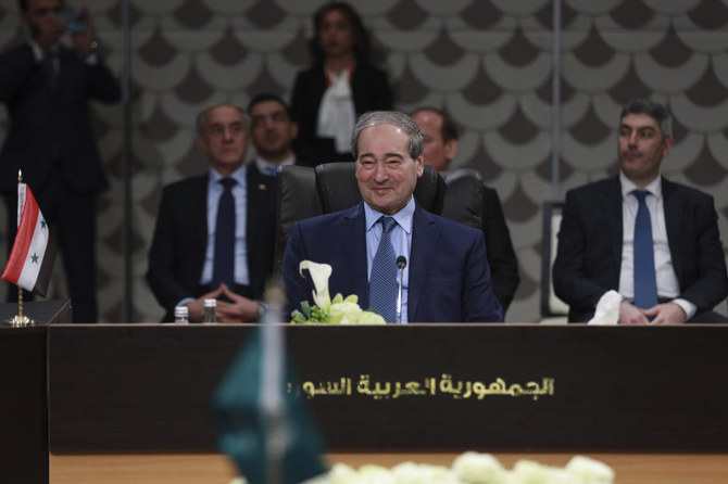 Syrian Foreign Minister Faisal Mekdad smiles as he attends a regional consultative meeting held in Amman, Jordan on Monday, May 1, 2023. (AP)