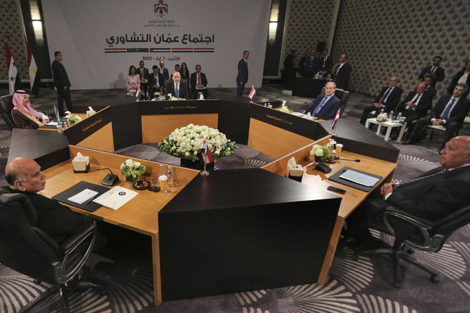 Jordan’s Foreign Minister Ayman Safadi, center background, Saudi Arabia’s Foreign Minister Prince Faisal bin Farhan Al-Saud, second left, Iraqi Foreign Minister Fouad Hussein, left, Egyptian Foreign Minister Sameh Shoukri, right, and Syrian Foreign Minister Faisal Mekdad, second right, attend a regional consultative meeting in Amman, Jordan, Monday, May 1, 2023. (AP)