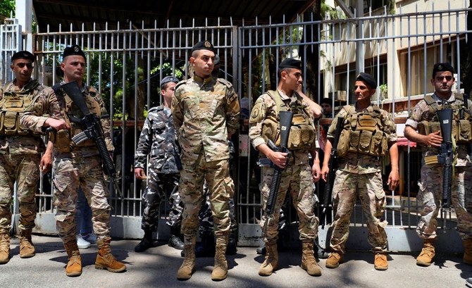 Army soldiers stand guard outside the Palace of Justice in Beirut, Lebanon, Thursday, May 4, 2023. (AP Photo)
