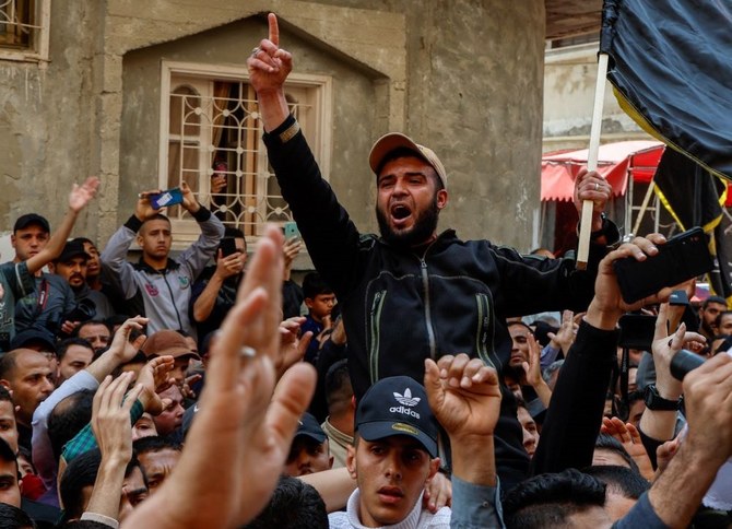 A mourner reacts during the funeral of Islamic Jihad commanders Tareq Izzeldeen and Khalil Al-Bahtini, and other Palestinians who were killed in Israeli strikes, Gaza City, May 9, 2023. (Reuters)