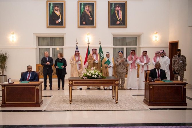 Representatives of the Sudanese Armed Forces and its rival Rapid Support Forces prepare to sign the Jeddah Declaration, witnessed by Saudi and US officials, during a ceremony in Jeddah on May 11, 2023. (SPA)