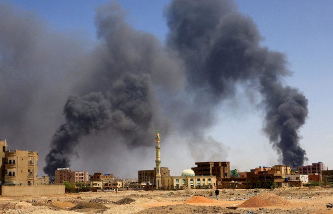 Smoke rises above buildings as artillery fire and airstrikes battered Khartoum. (Reuters)