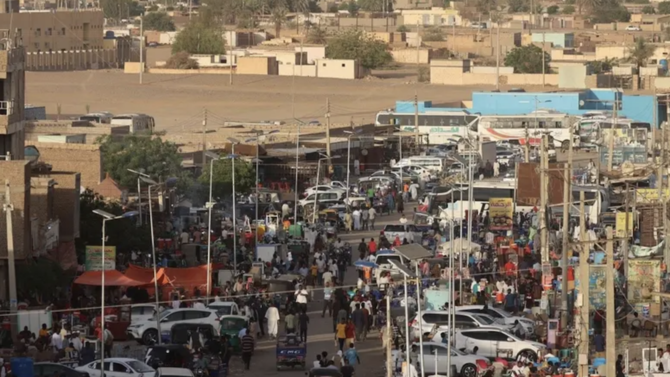 People gather in the Sudanese town of Wadi Halfa bordering Egypt on May 4, 2023. (AFP)
