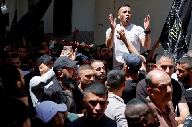 Mourners attend the funeral of Palestinian man Saleh Sabra, who was killed in an Israeli raid, in Askar Camp in Nablus, in the Israeli-occupied West Bank, May 15, 2023. (Reuters)