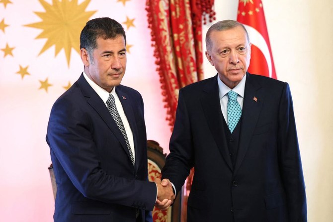 This handout photograph taken and released on May 19, 2023 shows Turkish President Recep Tayyip Erdogan meeting the former presidential candidate of the ATA Alliance Sinan Ogan at Dolmabahce Office in Istanbul. (AFP)