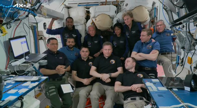 A group shot of the International Space Station crew with Saudi astronauts Rayyanah Barnawi and Ali Al-Qarni. (Screenshot/Axiom)
