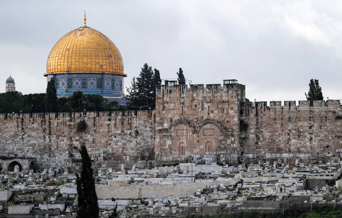 This picture taken on January 24, 2020 shows a view of (front) the Golden Gate, also known as the Gate of Mercy, that is part of the Old City of Jerusalem's walls, with the Dome of the Rock at al-Aqsa mosque compound behind. (AFP)
