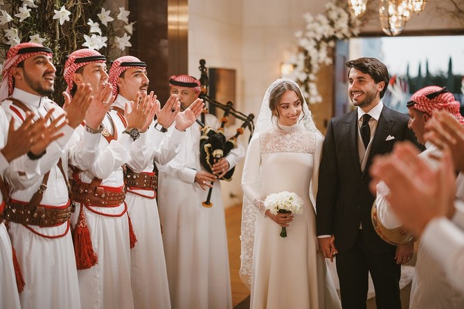 Jordanian traditions include the zaffeh and using an heirloom sword to cut the cake, as seen at Princess Iman’s wedding in March. (Getty Images)