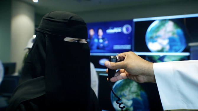 The two Saudi astronauts make radio contact with a group of Saudi students during the passage of the International Space Station over a ground station in Riyadh. (Twitter: @saudispace)