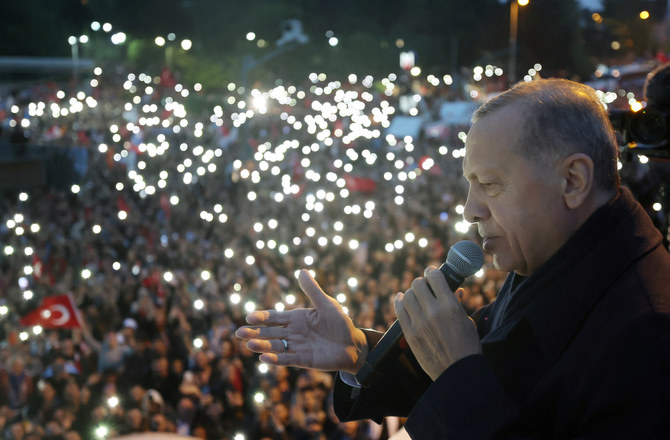 Turkish President Tayyip Erdogan addresses his supporters following early exit poll results for the second round of the presidential election in Istanbul. (Reuters)