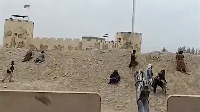 In this screengrab taken from a widely shared video, Taliban security forces in Nimroz province take defensive position at the Afghanistan-Iran border on May 27, 2023. (Twitter)