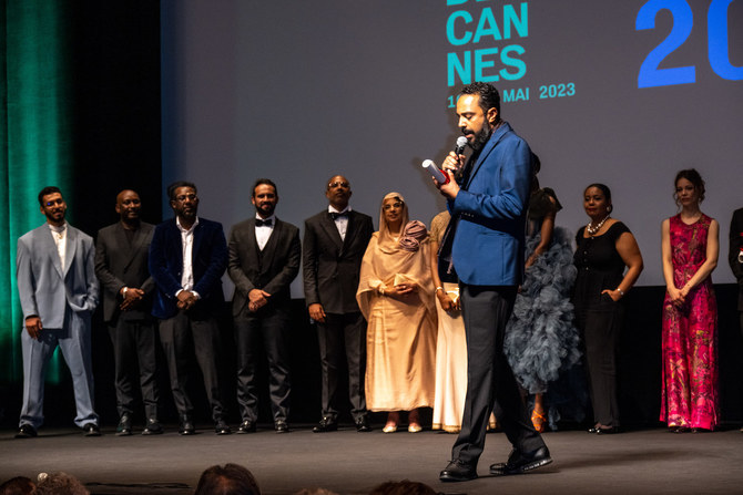 Sudanese film director Mohamed Kordofani addresses the crowd after receiving the Freedom Award for his film “Goodbye Julia” at the Cannes Film Festival. (Ammar Abd Rabbo/Arab News)