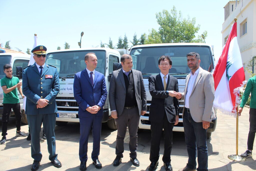 Japanese Ambassador to Lebanon MAGOSHI Masayuki, Governor of Baalbek-Hermel, Bashir Khodr, and General Manager of LOST Dr. Rami Lakkis standing in front of the waste collection vehicles. (Supplied)
