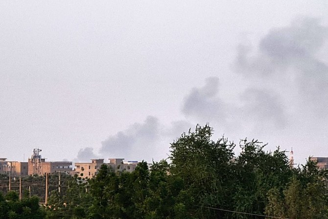 Smoke billows above buildings in Khartoum on May 20, 2023, as violence between two rival generals continues. (AFP)