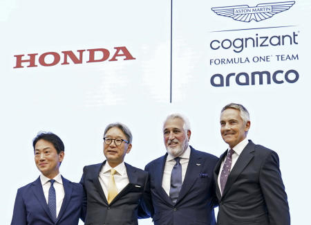 From left to right, Koji Watanabe, president of Honda Racing Corporation, Toshihiro Mibe, president of Honda Motor Co., Lawrence Stroll, executive chairman of the Aston Martin team, and Martin Whitmarsh, Group CEO of Aston Martin Performance Technologies, pose for a photo during a press conference in Tokyo, Japan, Wednesday, May 24, 2023. (Kyodo News via AP)