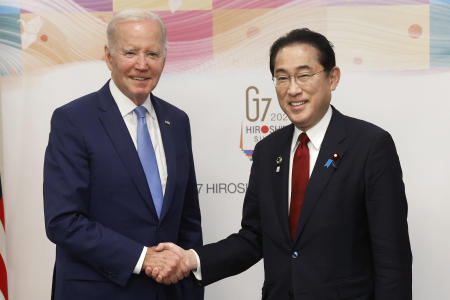 US President Joe Biden (left), and Japan's Prime Minister Fumio Kishida shake hands prior to a bilateral meeting ahead of the Group of Seven (G-7) leaders summit in Hiroshima, Japan, on Thursday, May 18, 2023. (AP)