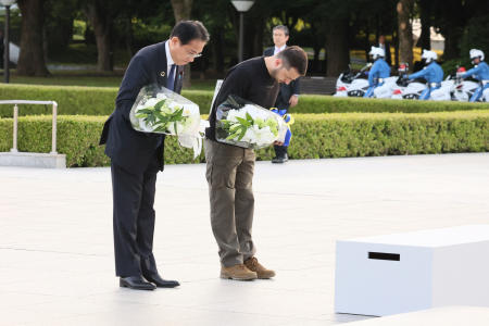 Ukrainian President Volodymyr Zelenskiy and Japanese Prime Minister Fumio Kishida bow as they lay a wreath in front of the Cenotaph for the Victims of the Atomic Bomb at the Hiroshima Peace Memorial Park, after Zelenskiy was invited to the G7 leaders' summit in Hiroshima, Japan, May 21, 2023, in this handout photo released by Ministry of Foreign Affairs of Japan. (Reuters)