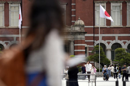 Pedestrians walking in Tokyo. (AFP)