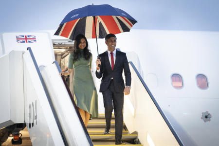 Britain's Prime Minister Rishi Sunak (right) and his wife Akshata Murty arrive by plane in Hiroshima, western Japan, after their visit to Tokyo, ahead of the G-7 Summit in Japan, Thursday May 18, 2023. (AP)