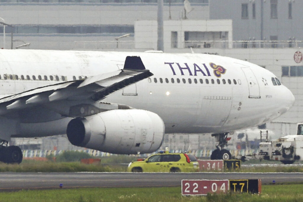 A Thai Airways International airplane is seen on a runway after contacting an Eva Airways plane, at Haneda airport in Tokyo, Saturday, June 10, 2023. (File/Kyodo News via AP)