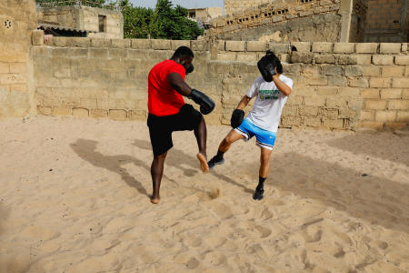 Shogo Uozumi, also known as Songo Tine, 29 years old, trains with his teammates at the Samba Dia stable in the Diakhao neighbourhood, in Thies, Senegal, May 26, 2023. (Reuters)