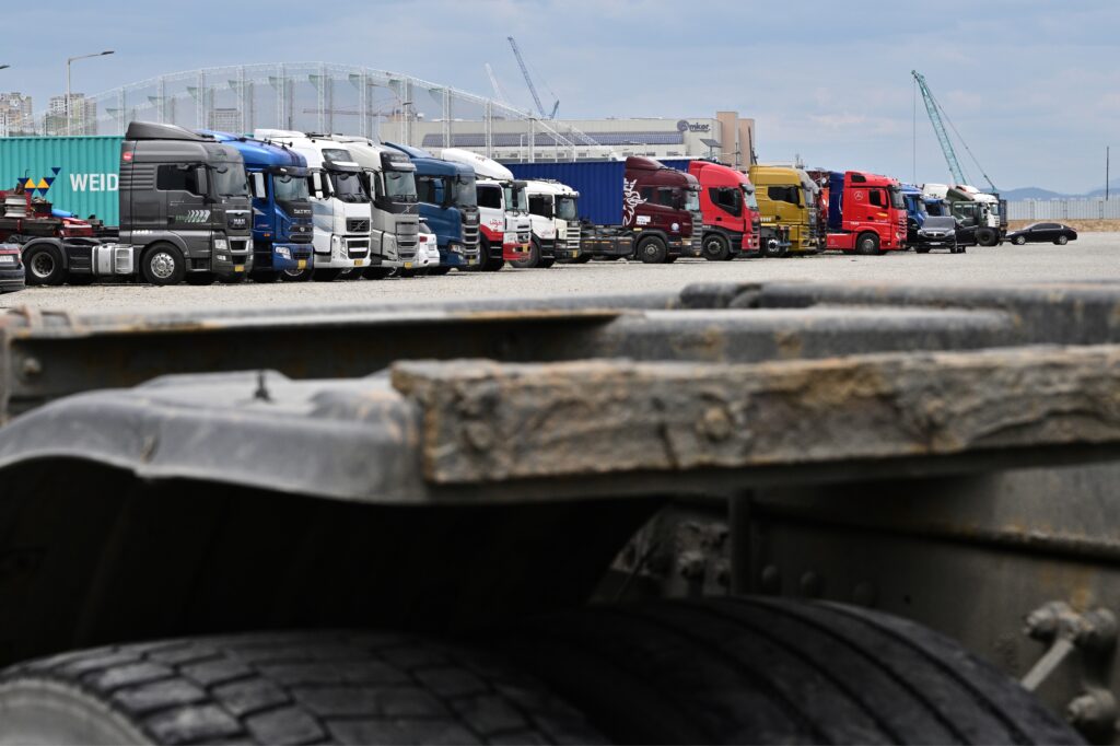 The global economy is facing a risk of division due to its deceleration and a rise of nations stepping up hegemonic moves, the report said. (AFP)