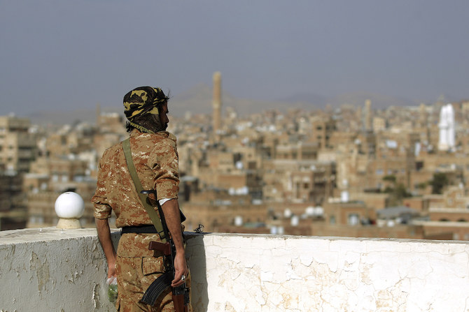 The Baha’i religious minority has faced significant persecution under Houthi rule. Above, a Houthi militia stands guard at a rooftop in Sanaa on Feb. 24, 2023. (AFP)