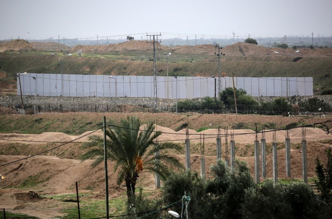 A picture taken in Rafah in the southern Gaza Strip at the border with Egypt shows a concrete wall under construction on the Egyptian side of the border on February 19, 2020. (AFP)