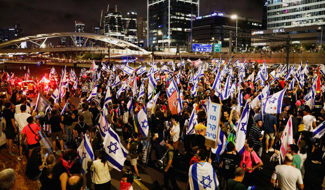 People block the highway during a demonstration against Israeli Prime Minister Benjamin Netanyahu and his nationalist coalition government's judicial overhaul, in Tel Aviv, Israel June 3, 2023. (REUTERS)