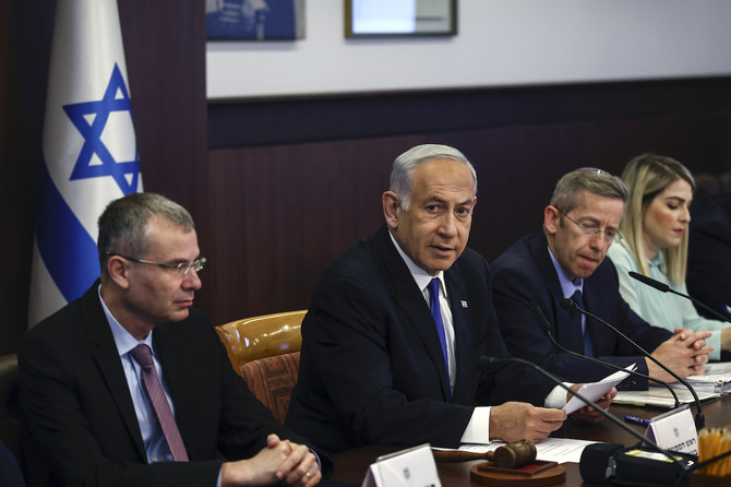 Israeli Prime Minister Benjamin Netanyahu, center, attends a weekly cabinet meeting in the prime minister's office in Jerusalem, Sunday June 4, 2023. (AP)