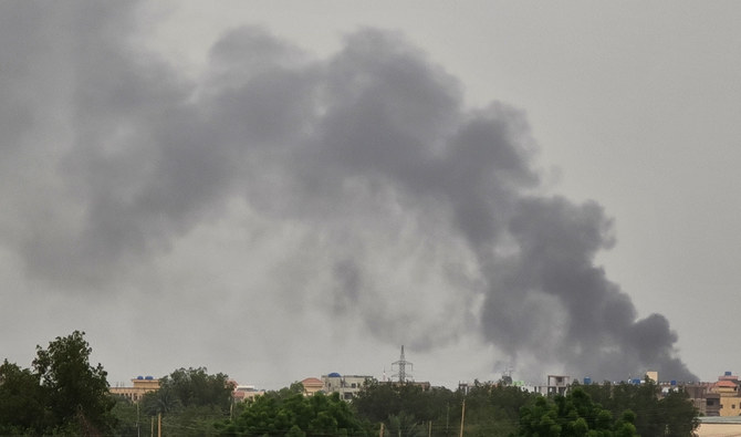 Smoke billows in the distance amid ongoing fighting in Khartoum on June 6, 2023. (AFP)