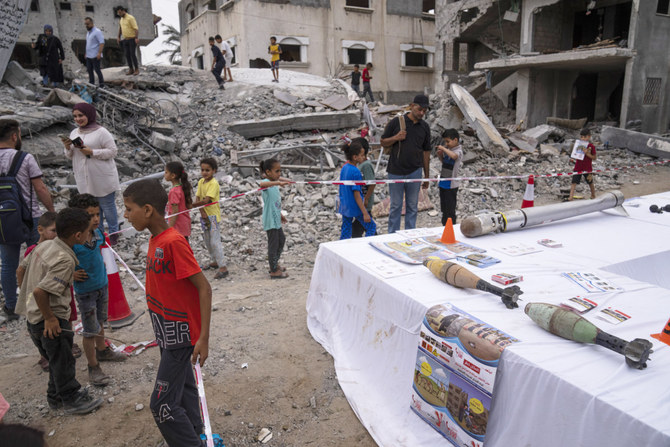 Gaza residents view mortar shells and fragments of exploded Israeli missiles on display from the rubble of homes destroyed in recent fighting with Israel in Deir al-Balah on June 8, 2023. US Secretary of State Antony Blinken on Thursday urged Israel not to undermine prospects for a Palestinian state. (AP)