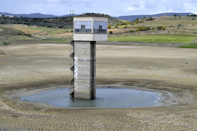 Above, the dry Chiba dam near the city of Korba in northeastern Tunisia on April 4, 2023. Tunisia’s dams are at critical lows following years of drought, exacerbated by pipeline leaks in a decrepit distribution network. (AFP)